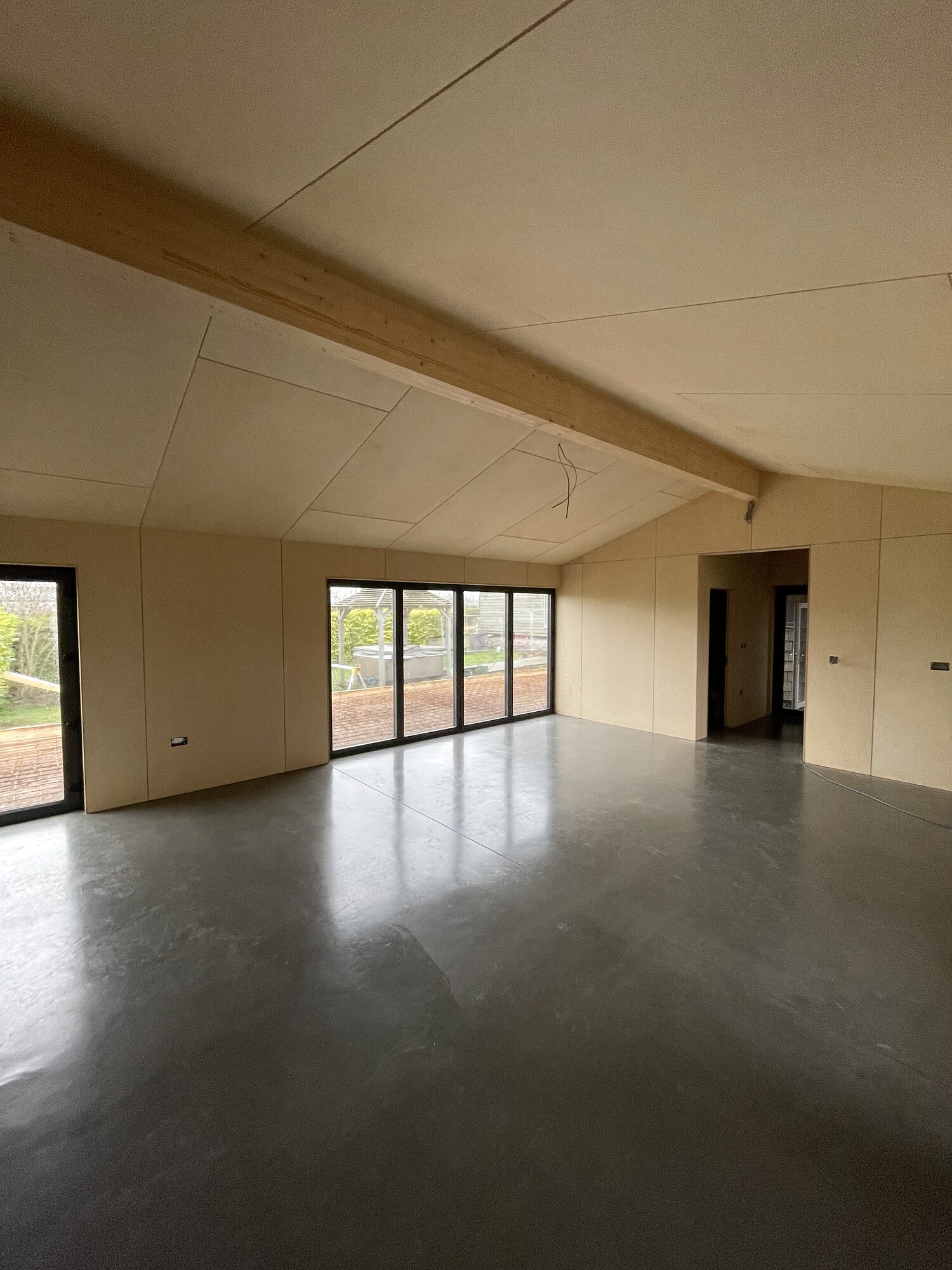Vaulted birch ply interior with polished concrete floor, The Birch Room