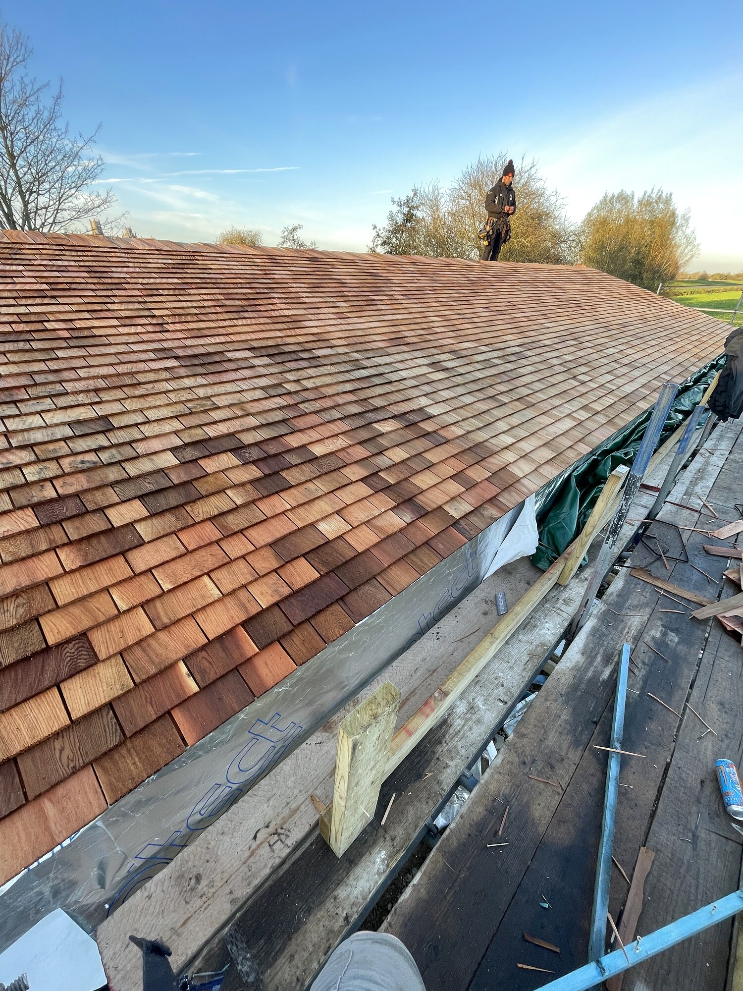 Cedar shingle roof under construction, The Birch Room