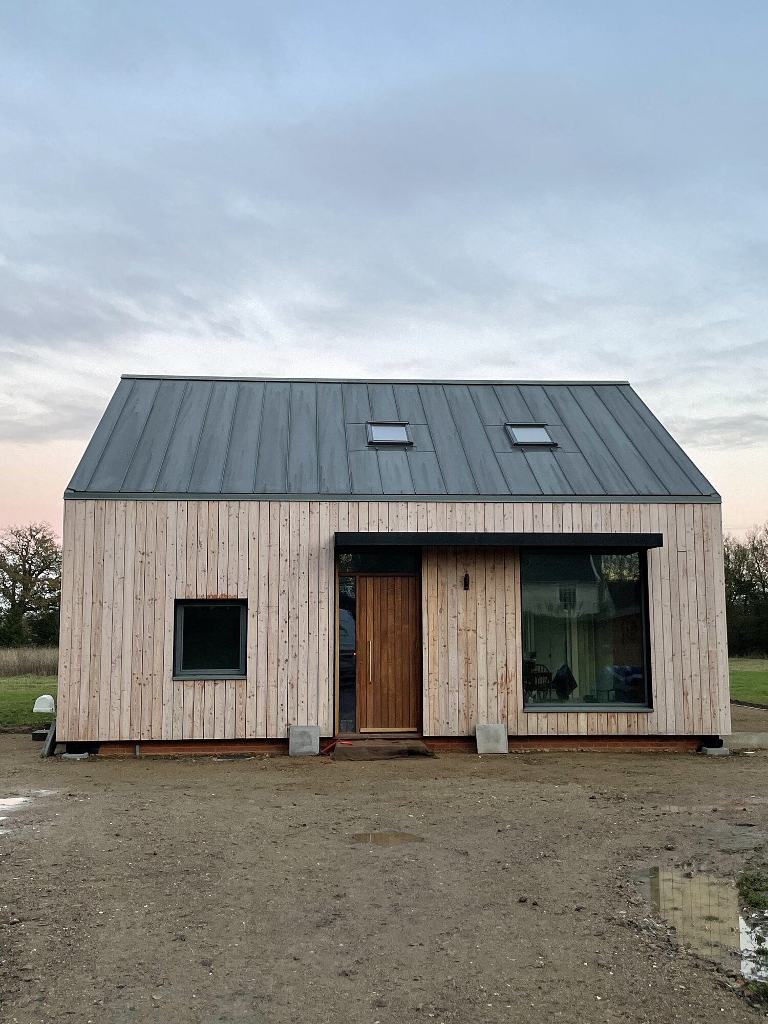 Finished barn-form new build with standing seam metal roof, Fieldview, Suffolk