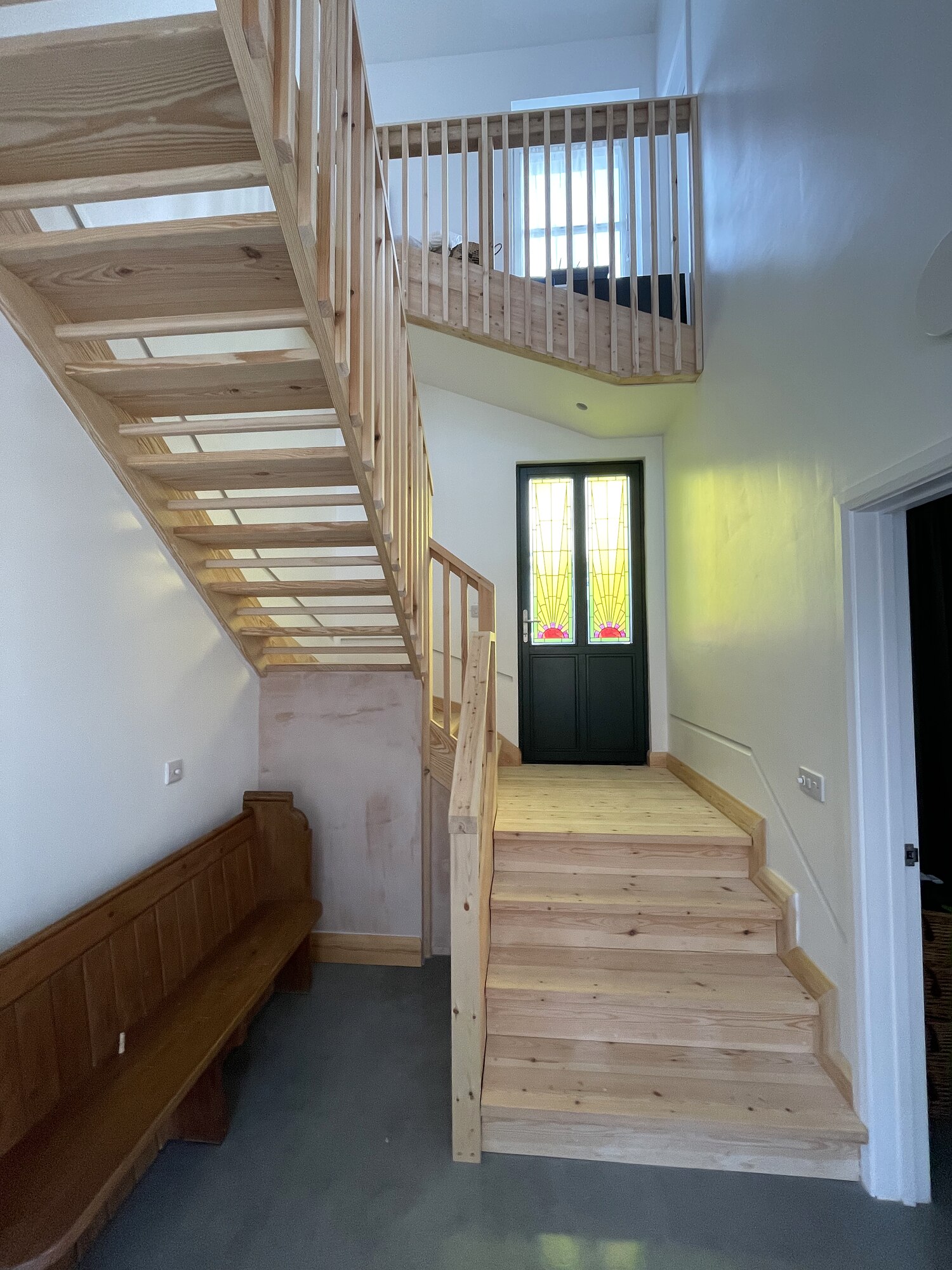 Bespoke open staircase with stained glass front door, The Stair House